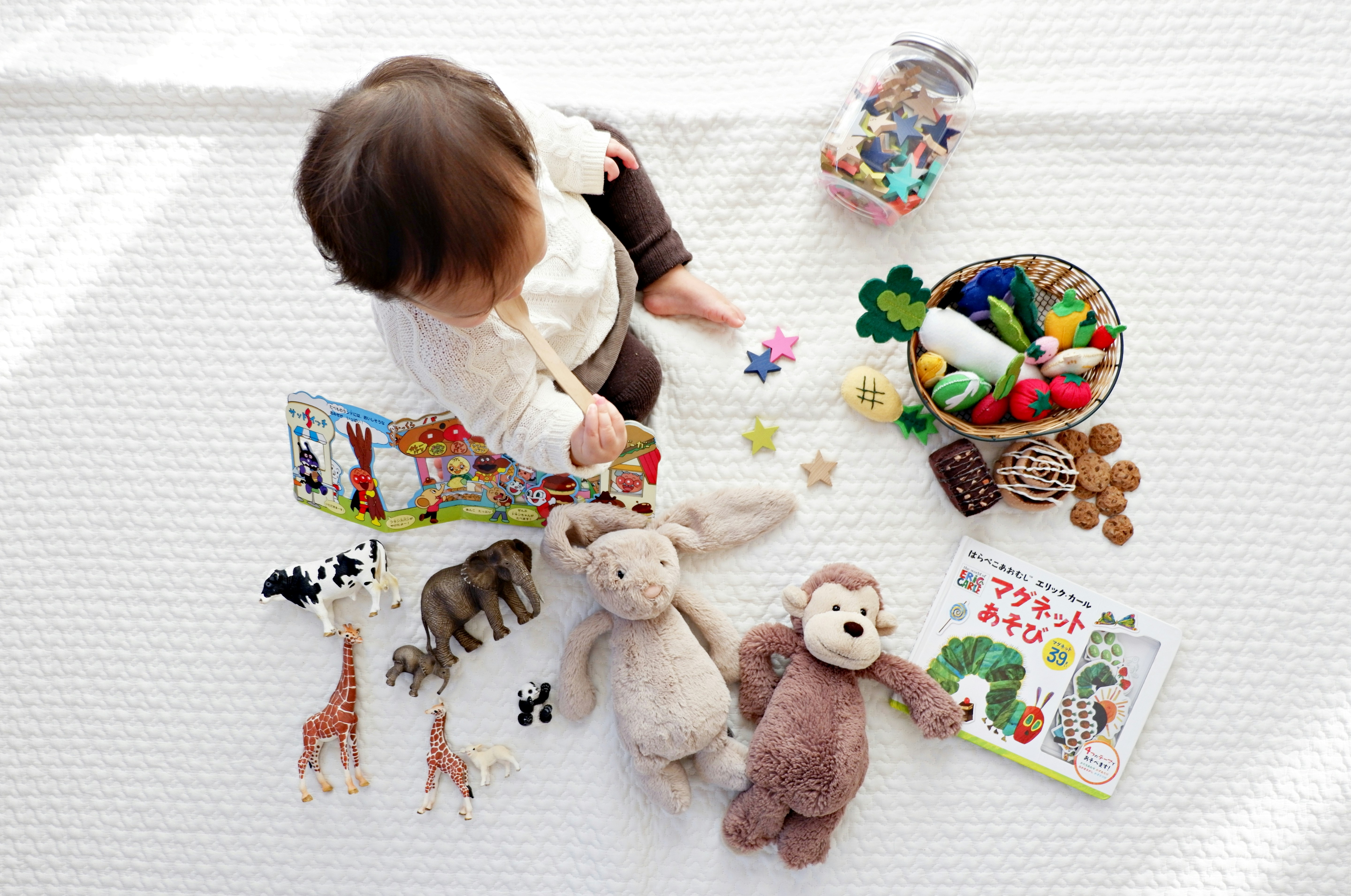 Infant Surrounded by Toys